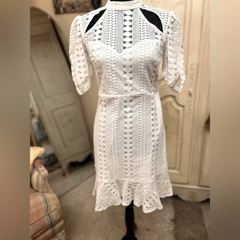 Beautiful white dress with detailing and zipper in the back